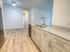 St Augustine apartment for rent - a kitchen with white cabinets and a sink