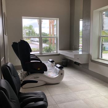 Pedicure station with massage chair and basin