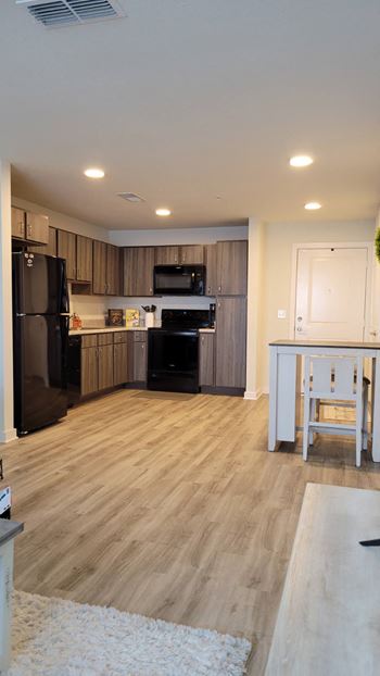 Macie creek apartments open concept kitchen, dining and living space