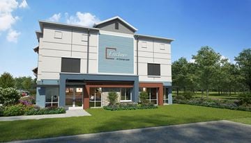 Orlando apartment for rent - A modern building with a sign that reads "Enclave at Cedarwood".