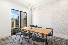 St. Johns apartment for rent - Modern dining room with wood table and blue chairs at Longleaf at St. Johns Apartments, St. Johns, FL 32259