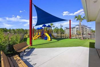 Childrens playground with shade sail and seating