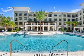 St. Johns apartment for rent - Resort style pool with palm trees and loungers at Longleaf at St. Johns Apartments, St. Johns, Florida