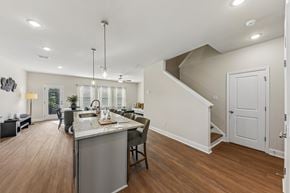 Fairburn townhouse for rent - A kitchen with a dining table and chairs is shown.
