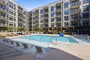 Charlotte townhouse for rent - A large swimming pool in front of apartment buildings.
