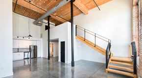 Greenville apartment for rent - A room with a wooden ceiling and a staircase.