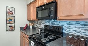 Henrico apartment for rent - a kitchen with a stove and a microwave