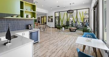 Dallas apartment for rent - A modern kitchen with a dining table and chairs.
