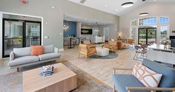 Lakeland apartment for rent - A living room with a grey couch and a wooden coffee table.