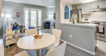 Arlington apartment for rent - A modern kitchen with a dining table and chairs.