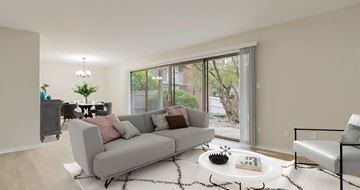 Overland Park apartment for rent - A living room with a grey couch and a coffee table.