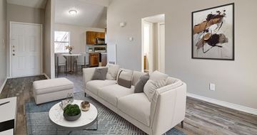 Lancaster apartment for rent - A living room with a white couch and a painting on the wall.