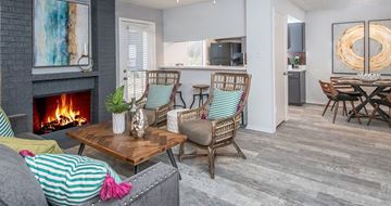 San Antonio apartment for rent - A living room with a fireplace and a painting on the wall.