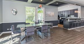 Lakemoor apartment for rent - a dining room and kitchen with a glass table and chairs