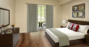 Deerfield Beach apartment for rent - a bedroom with a bed and a window with curtains