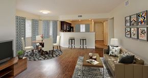 Deerfield Beach apartment for rent - a living room and kitchen with a couch and a table
