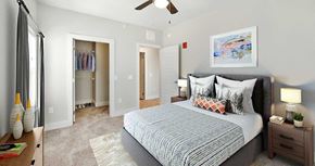 Papillion apartment for rent - a bedroom with a bed and a closet
