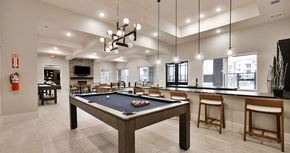 Papillion apartment for rent - a game room with a pool table and a bar