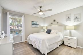 Orlando apartment for rent - a bedroom with a bed and a ceiling fan