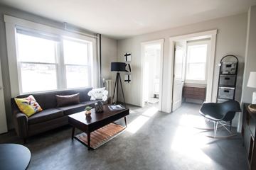 Omaha apartment for rent - A living room with a brown couch and a coffee table.
