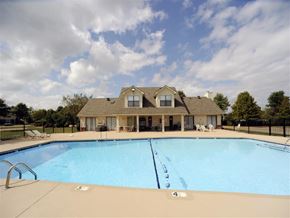 Jonesboro apartment for rent - a swimming pool with a house in the background