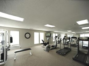 Jonesboro apartment for rent - a gym with various exercise equipment in a large room
