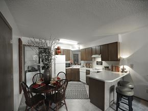 Jonesboro apartment for rent - a kitchen and dining room with a table and chairs