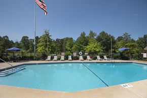 Little Rock apartment for rent - A pool with a flag on a pole.