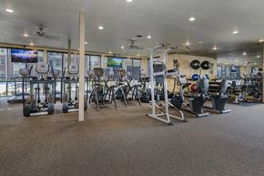 Benton apartment for rent - A gym with a variety of equipment including treadmills, weights, and exercise machines.