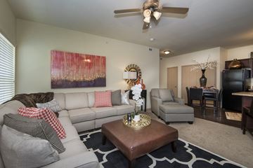 Benton apartment for rent - A living room with a grey couch and a brown coffee table.
