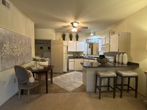 Bryant apartment for rent - A kitchen with a dining table and chairs.