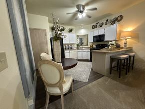 Conway apartment for rent - A kitchen with a chair in front of it.