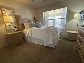 Little Rock apartment for rent - A bedroom with a large bed and a window.
