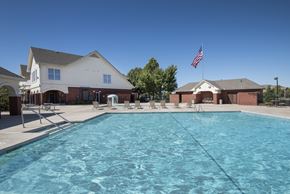 Yukon apartment for rent - our apartments have a large swimming pool in front of our building