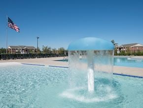 Norman apartment for rent - A blue water fountain in the middle of a pool.