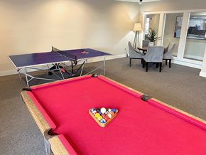 Rogers apartment for rent - a games room with a pool table and ping pong