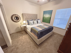 Rogers apartment for rent - a bedroom with a bed and two windows