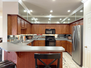 Fayetteville apartment for rent - a kitchen with wooden cabinets and a counter top