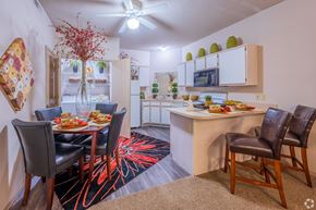Moore apartment for rent - a dining room and kitchen with a dining table and chairs