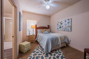 Moore apartment for rent - a bedroom with a bed and a ceiling fan