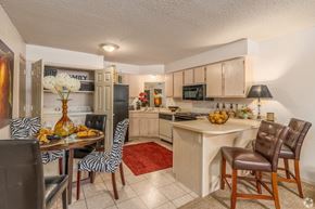 Broken Arrow apartment for rent - a kitchen and dining room with a table and chairs