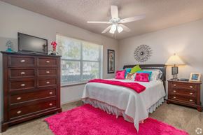 Broken Arrow apartment for rent - a bedroom with a bed and a ceiling fan