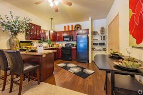 Edmond apartment for rent - a kitchen and dining area with a table and chairs