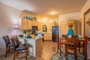 Moore apartment for rent - an open kitchen and dining area with a dining table and chairs
