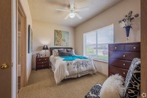 Moore apartment for rent - a bedroom with a bed and a ceiling fan