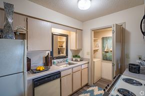 Oklahoma City apartment for rent - a kitchen with a sink and a stove and a refrigerator