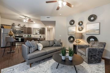 Fayetteville apartment for rent - a living room with a couch and a table