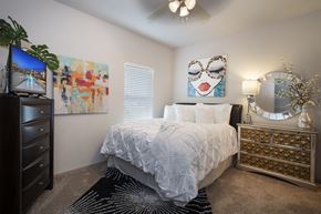 Springfield apartment for rent - view of bedroom with bed and dresser and tv at the preserve at greatstone