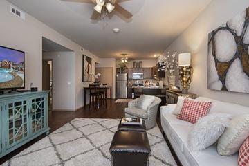 Benton apartment for rent - A living room with a white couch and a television.