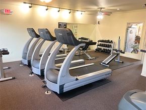 Bentonville apartment for rent - a state of the art gym with cardio machines and weights